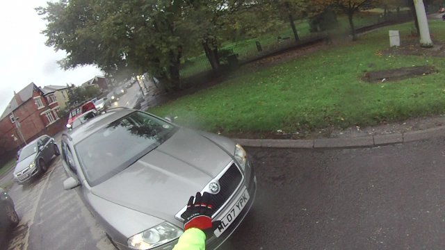 Idiotic driver trying to squeeze past on the inside.