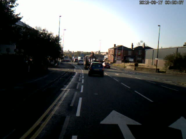 Cycle Lane Narrows Across Side Road and Bend Cycle Lane Narrows Across Side Road and Bend